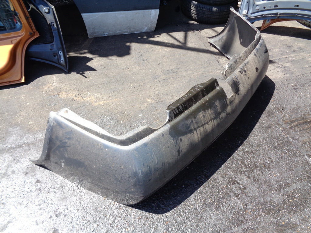 NISSAN PRIMERA 2004 MK1 REAR BUMPER WITH TOW BAR CUT GREY