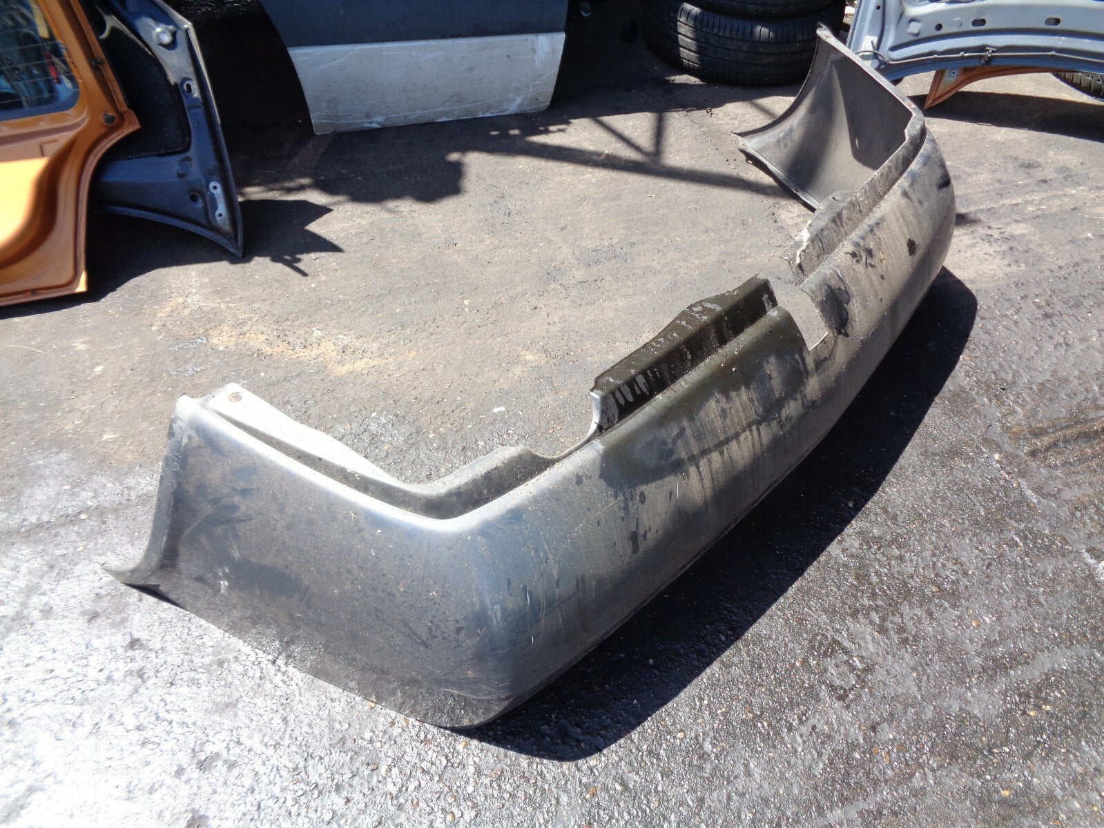 NISSAN PRIMERA 2004 MK1 REAR BUMPER WITH TOW BAR CUT GREY