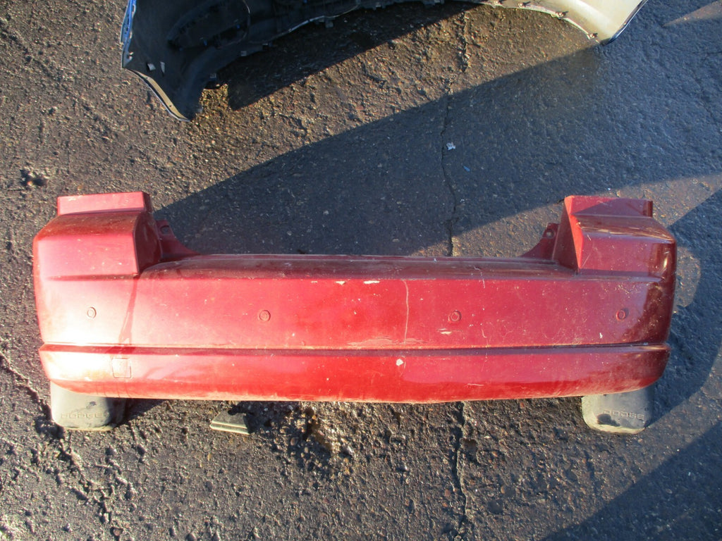 DODGE CALIBER 2008 COMPLETE REAR BACK PLASTIC BUMPER WITH MUD GUARD FLAP IN RED