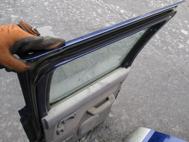 NISSAN NAVARA D22 2003 OSR DRIVER SIDE REAR COMPLETE DOOR BLUE 2Y9