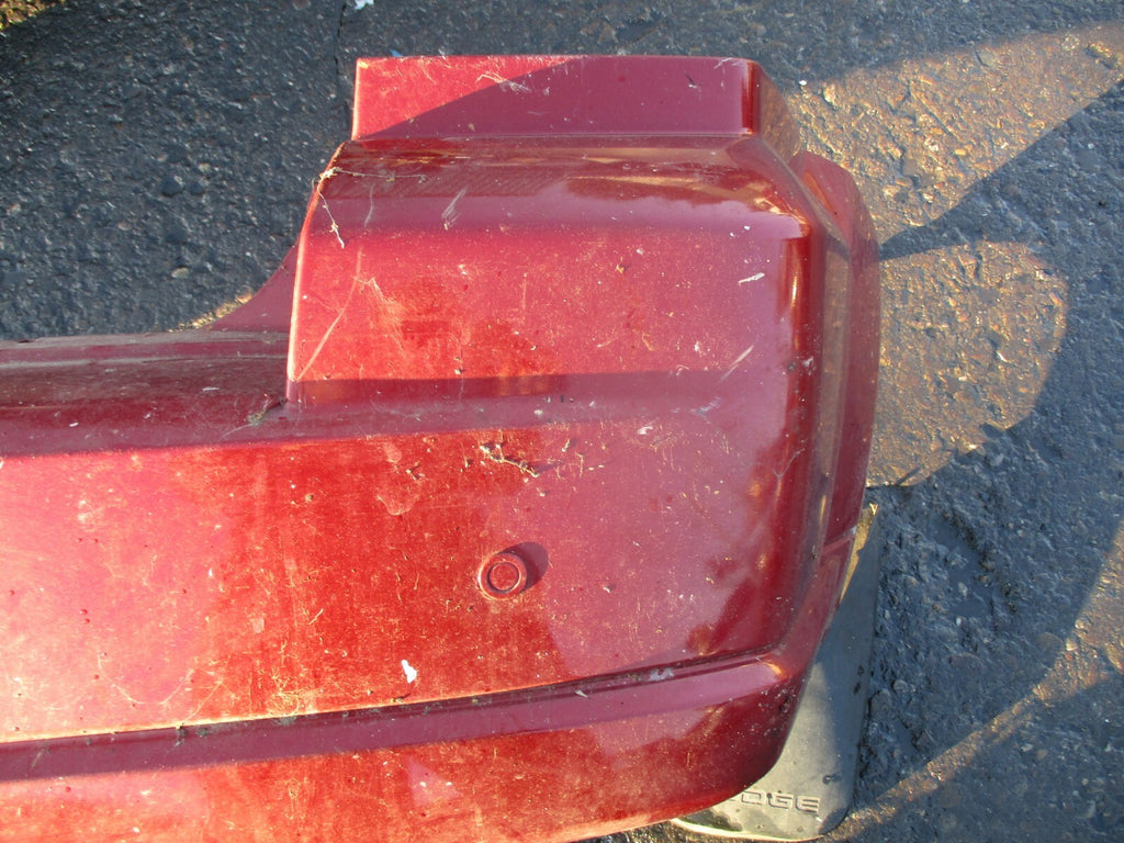 DODGE CALIBER 2008 COMPLETE REAR BACK PLASTIC BUMPER WITH MUD GUARD FLAP IN RED